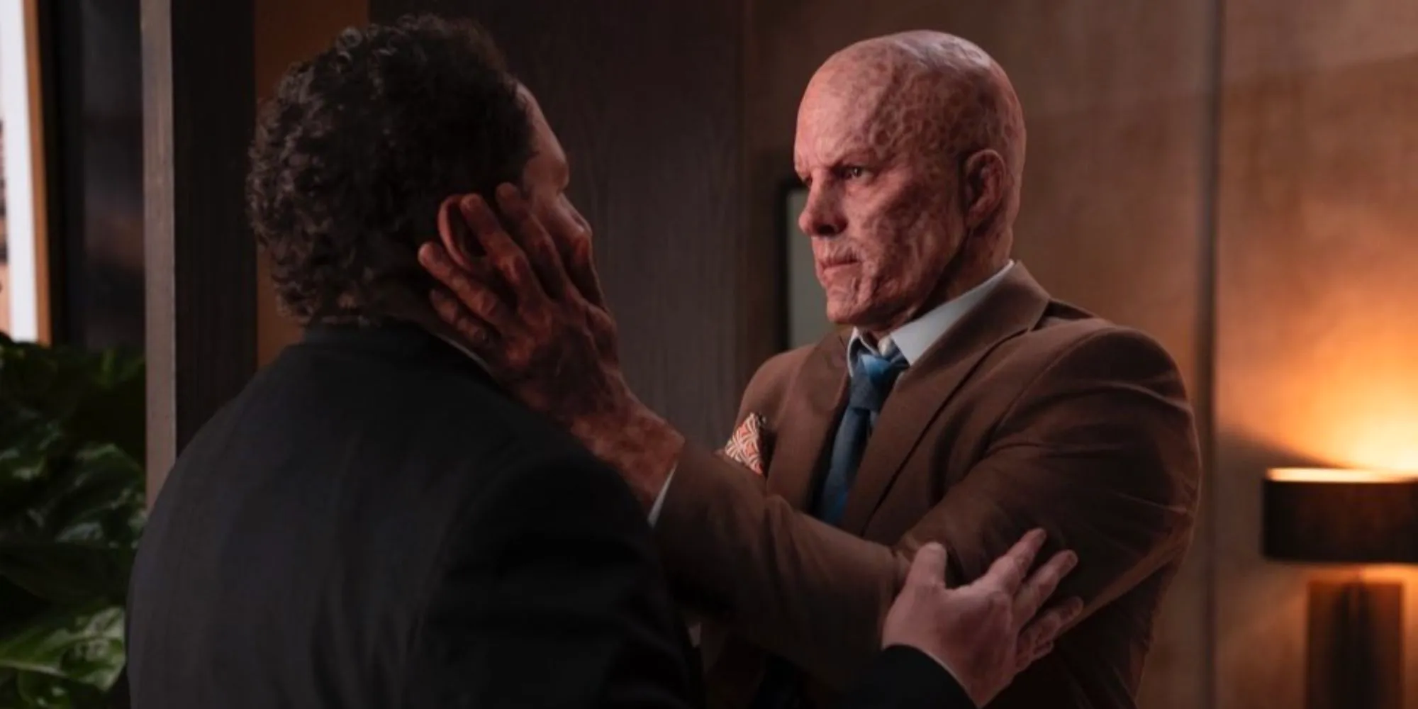 Wade Wilson grabs Happy Hogan's face at Avengers HQ in Deadpool & Wolverine Image