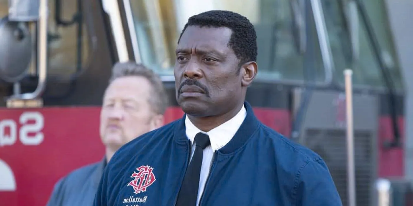 Wallace Boden looking stern in front of a fire truck in Chicago Fire Image