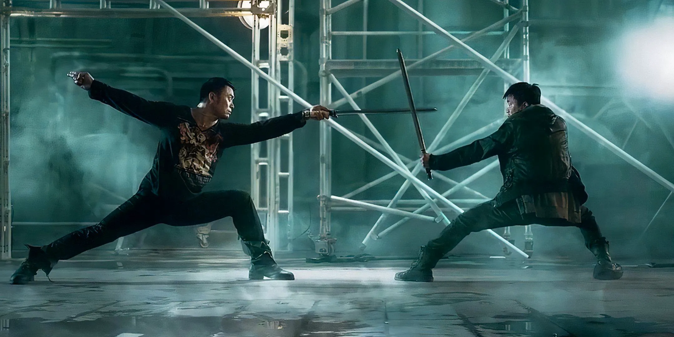 Wang Baoqiang and Siu-Wong Fan fight one another with swords. Image