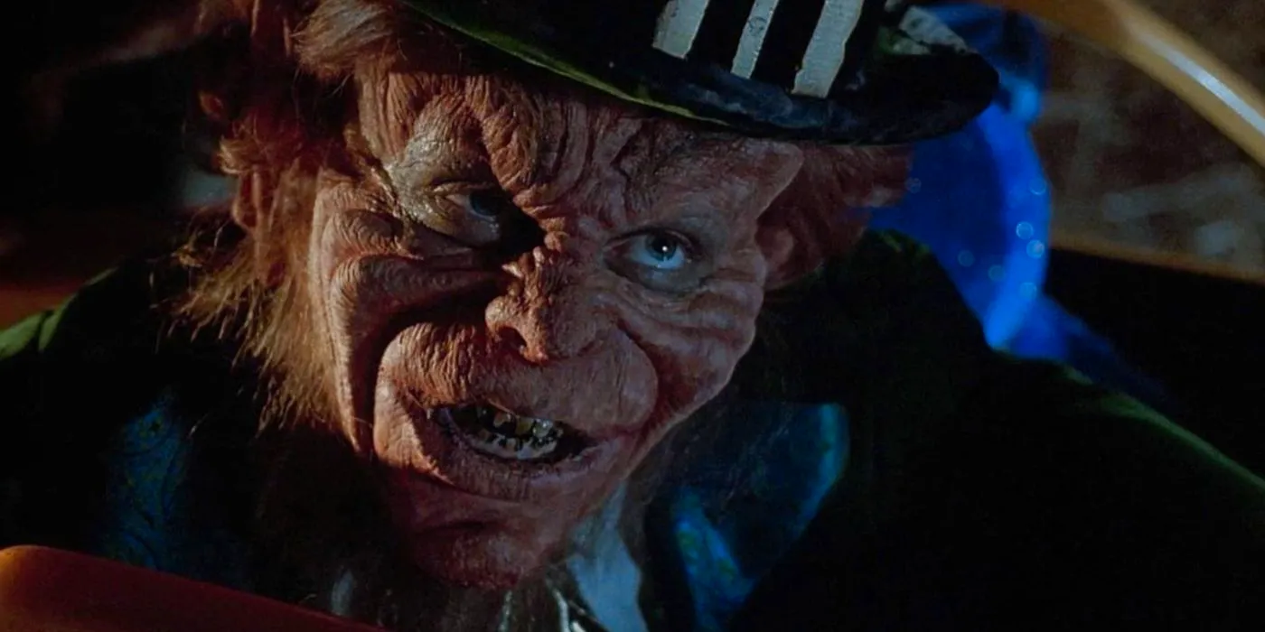 Warwick Davis as Leprechaun smiling at someone in Leprechaun Image