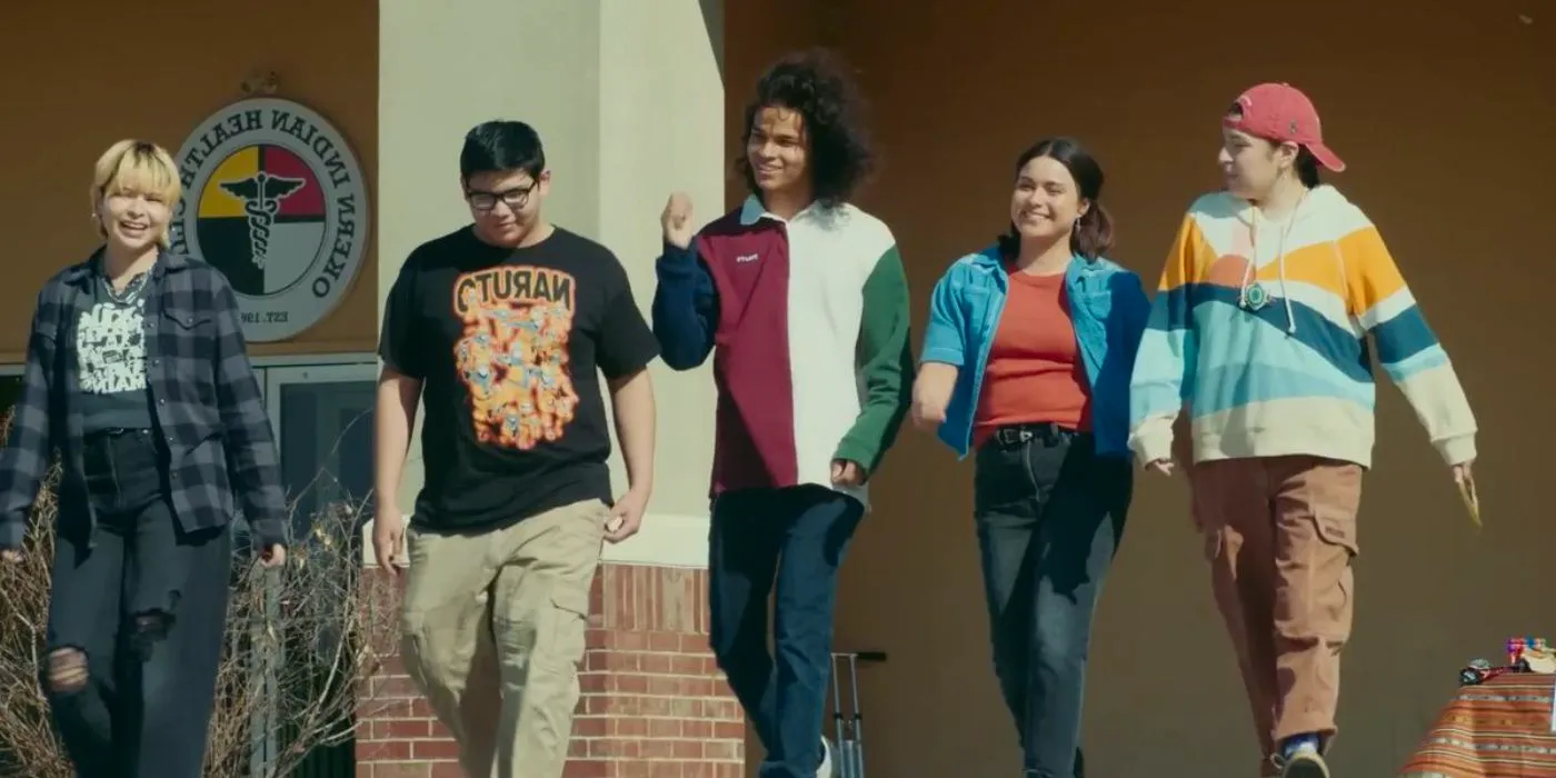 Willie Jack (Paulina Alexis), Elora (Devery Jacobs), Bear (D'Pharaoh Woon-A-Tai), and Cheese (Lane Factor), and Jackie (ELva Guerra) walking and laughing together in Reservation Dogs. Image