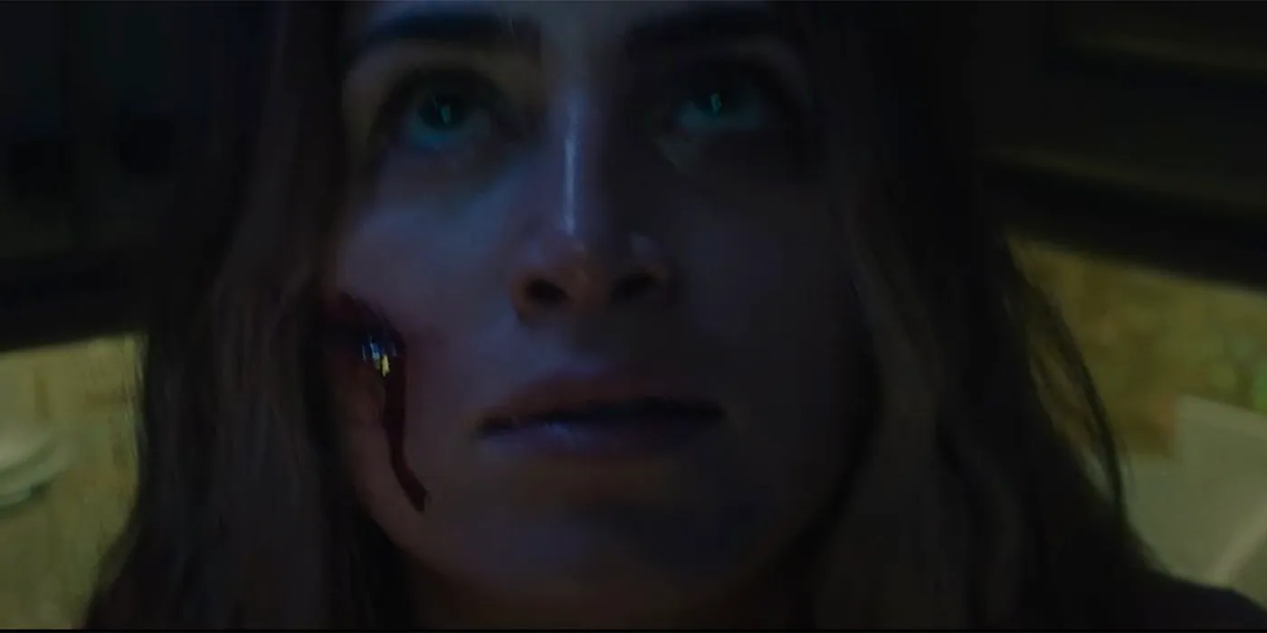 Woman with blood on her face in Blood Lake Image