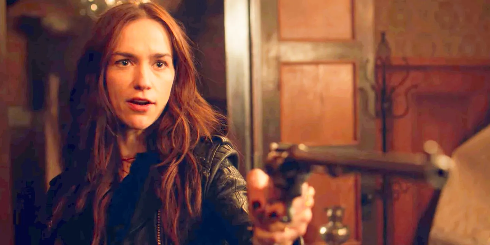 Wynonna Earp standing with her gun drawn Image